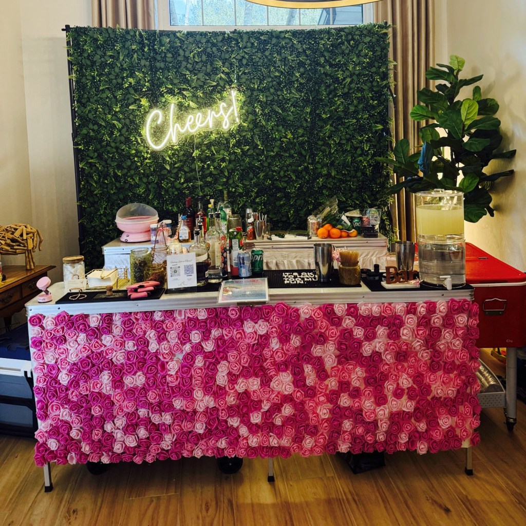 Bar with flowers and greenery backdrop